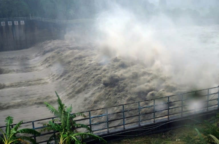 Churning waters in the Jhihtan Dam is seen in Xindian district, New Taipei City, as Typhoon Megi hit eastern Taiwan