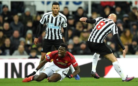 Paul Pogba of Manchester United reacts after being fouled by Jonjo Shelvey of Newcastle United during the Premier League match between Newcastle United and Manchester United  - Credit: Getty Images