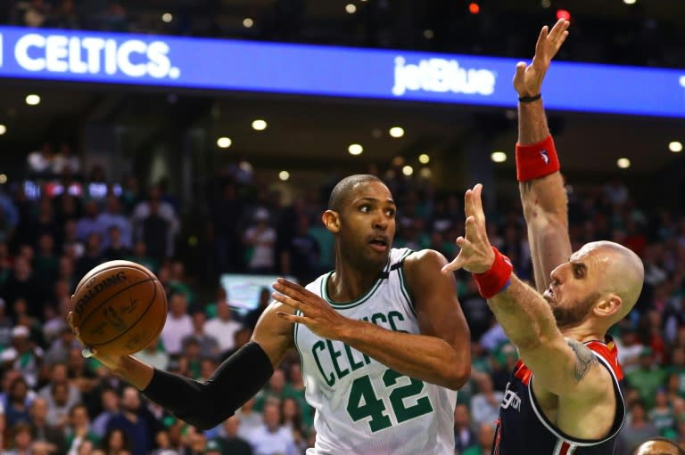 Al Horford of the Boston Celtics looks for a pass around Marcin Gortat of the Washington Wizards during Game Two of the Eastern Conference Semifinals