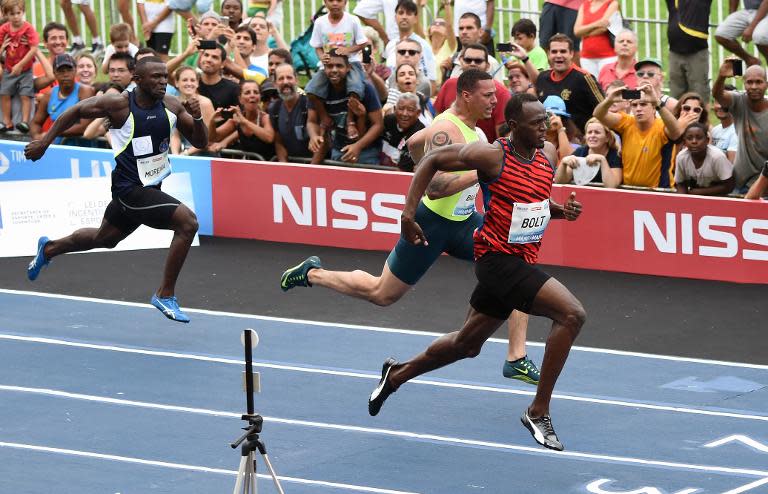 Usain Bolt (right) competes in an exhibition race at Jockey Club in Rio de Janeiro, Brazil, on April 19, 2015