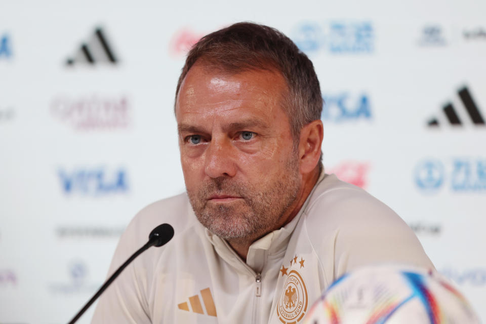 DOHA, QATAR - NOVEMBER 26: Hansi Flick, Head Coach of Germany, speaks during the Germany Press Conference at the Main Media Center on November 26, 2022 in Doha, Qatar. (Photo by Mohamed Farag/2022 Getty Images)