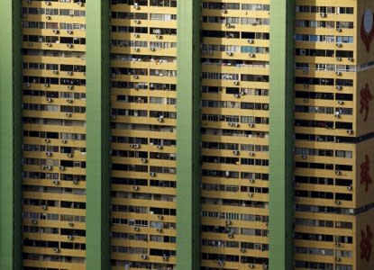 FILE PHOTO: Air-conditioning units dot the facade of the People's Park Complex residential apartment in Singapore's Chinatown February 29, 2016.  REUTERS/Edgar Su/File Photo