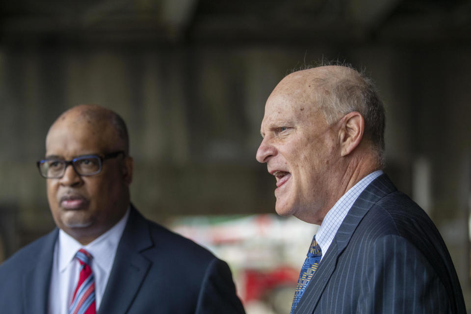 Attorneys Bill Thomas, left, and Randy Chartash speak about their client, former Georgia Insurance Commissioner Jim Beck outside of the Russell B. Federal Courthouse in downtown Atlanta, Tuesday, Oct. 12, 2021. A federal judge has sentenced Beck to more than seven years in prison for fraud. The judge on Tuesday also ordered Beck to pay $2.6 million in restitution to make up for money he stole from an insurer. (Alyssa Pointer/Atlanta Journal-Constitution via AP)