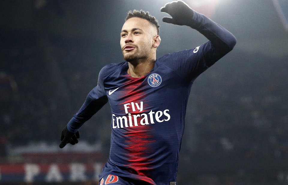 PSG's Neymar celebrates after scoring the opening goal during the League One soccer match between Paris Saint Germain and Guingamp at the Parc des Princes stadium in Paris, Saturday, Jan. 19, 2019. (AP Photo/Michel Euler)