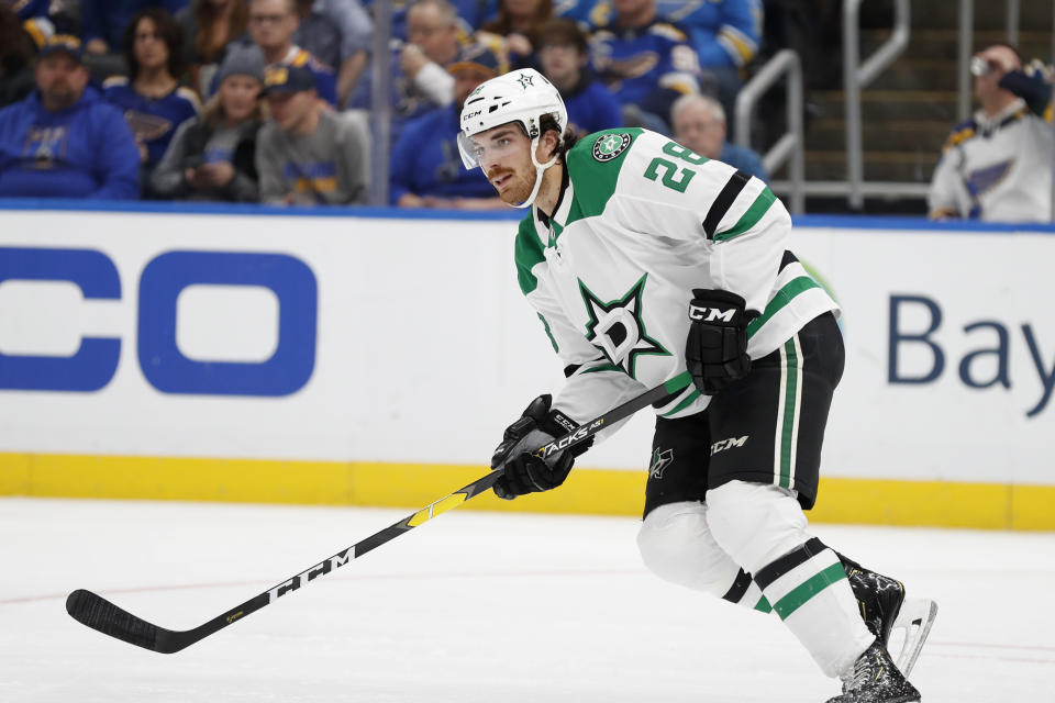 FILE - In this Saturday, Feb. 8, 2020 file photo, Dallas Stars' Stephen Johns in action during the second period of an NHL hockey game against the St. Louis Blues in St. Louis. Recently retired Dallas Stars defenseman Stephen Johns had a history of concussions and realized during a game last year that his NHL career was over. Depression threatened to take over his life, so Johns decided to rollerblade across the U.S. to bring awareness to mental health. (AP Photo/Jeff Roberson, File)