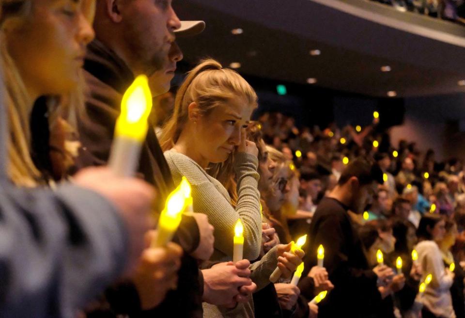 People gather to pray for the victims of a mass shooting during a candlelight vigil in Thousand Oaks