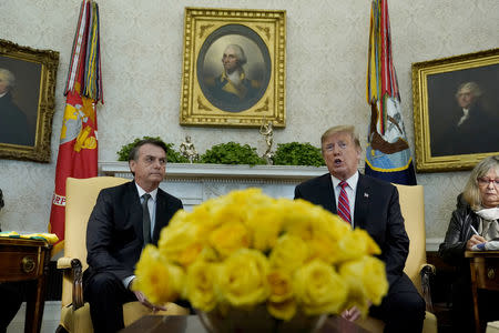 U.S. President Donald Trump speaks while meeting with Brazilian President Jair Bolsonaro in Oval Office of the White House in Washington, U.S., March 19, 2019. REUTERS/Kevin Lamarque