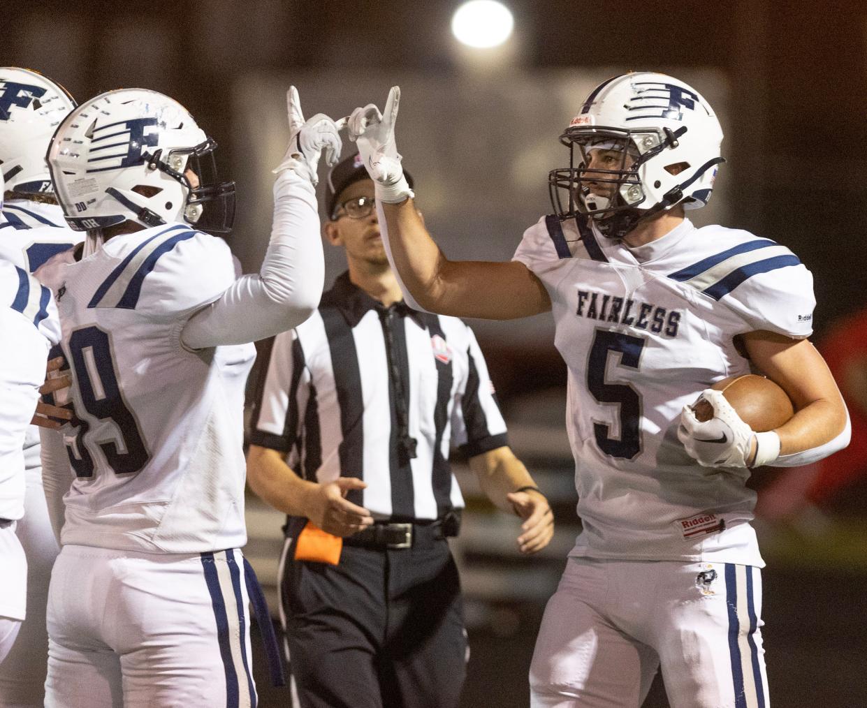 Fairles' Maddox Durant ,left, celebrates Gio Moore's first half touchdown at Canton South Friday, October 6, 2023.