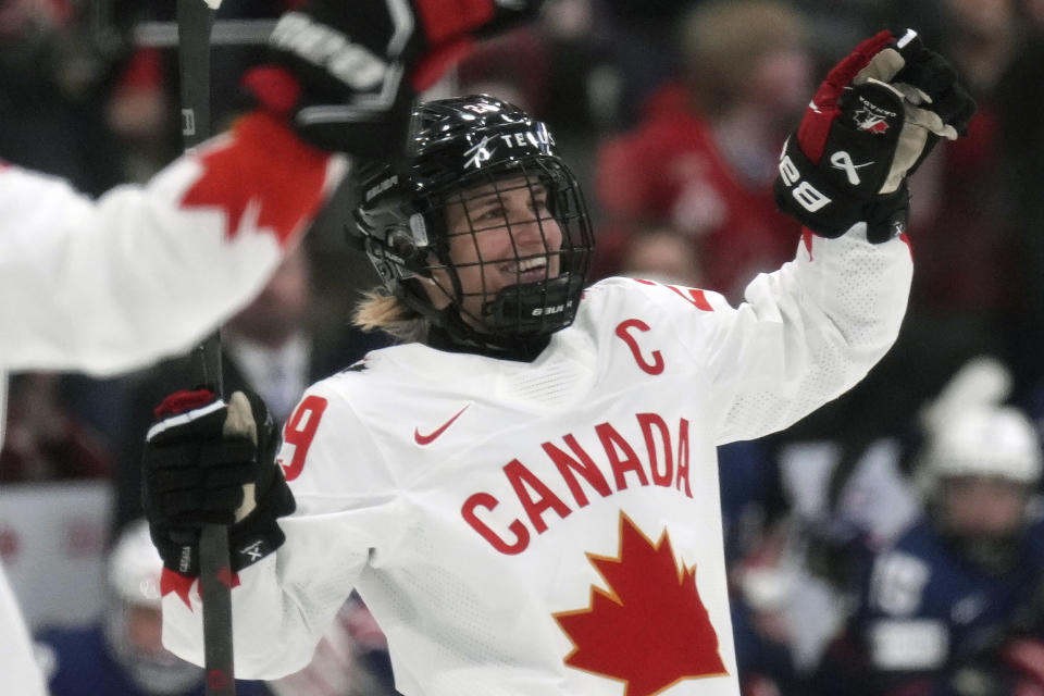 FILE - Canada forward Marie-Philip Poulin (29) celebrates after her goal against the United States during the first period of the women's world hockey championships in Brampton, Ontario, Sunday, April 16, 2023. Hilary Knight, Marie-Philip Poulin and their United States and Canadian national hockey team contemporaries now have a firm idea of where they’ll be playing in January. The newly founded Professional Women's Hockey League unveiled its Original Six franchises on Tuesday, Aug. 29, with franchises based in NHL markets — three in the United States and three in Canada — with track records of supporting the women’s game. (Nathan Denette/The Canadian Press via AP, File)