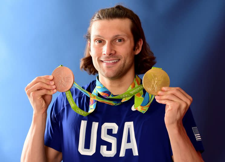 Cody Miller poses for a photo after winning a bronze and a gold medal at the Olympic Games. (Getty)