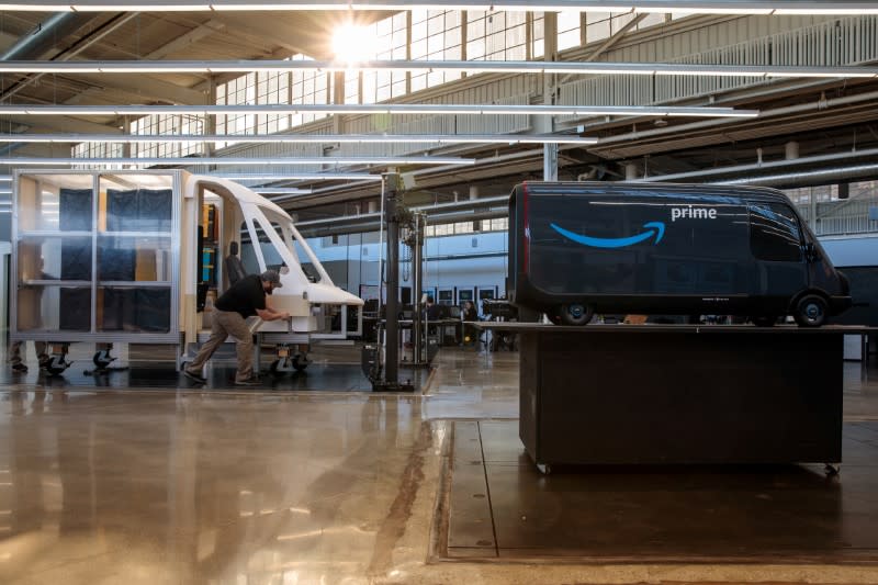Models of the Rivian-built Amazon electric delivery vans are seen in this handout photo in Plymouth