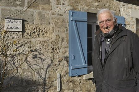 Jean Vanier, poses outside his home in Trosly-Breuil, in this picture taken March 7, 2015. Vanier, a Canadian who launched an international network of communities for the mentally disabled, has won the 2015 Templeton Prize worth $1.7 million for affirming life's spiritual dimension March 11, 2015. REUTERS/Tom Heneghan