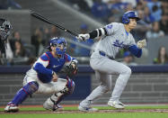 Los Angeles Dodgers designated hitter Shohei Ohtani (17) grounds out next to Toronto Blue Jays catcher Danny Jansen (9) during the third inning of a baseball game Friday, April 26, 2024, in Toronto. (Nathan Denette/The Canadian Press via AP)