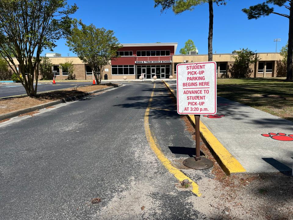 The drop off and pick up area of Trask Middle is empty while students are on spring break. New Hanover County Schools plans to create more driveways and paved areas to increase the school's drop off and pick up area in hopes of calming traffic congestion on North College Road. MATTHEW PRENSKY/STARNEWS