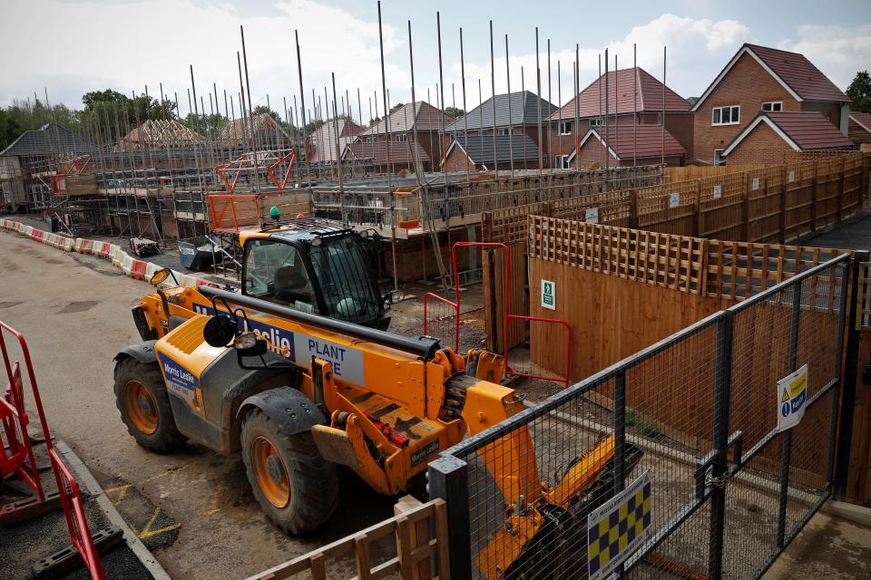 New-build residential homes are pictured during construction at a Redrow housing development, stalled due to the COVID-19 pandemic, in Arborfield near Reading on May 1, 2020. - Construction work has stopped since the UK has been under lockdown. However, the government will release a series of papers next week outlining its approach on how to safely and gradually restart the economy. (Photo by ADRIAN DENNIS / AFP) (Photo by ADRIAN DENNIS/AFP via Getty Images)