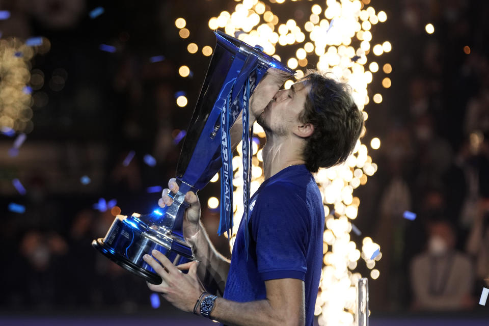 Alexander Zverev of Germany holds his trophy after winning the singles final tennis match of the ATP World Tour Finals, at the Pala Alpitour in Turin, Italy, Sunday, Nov. 21, 2021. Zverev defeated Daniil Medvedev of Russia 6-4/6-4.(AP Photo/Luca Bruno)