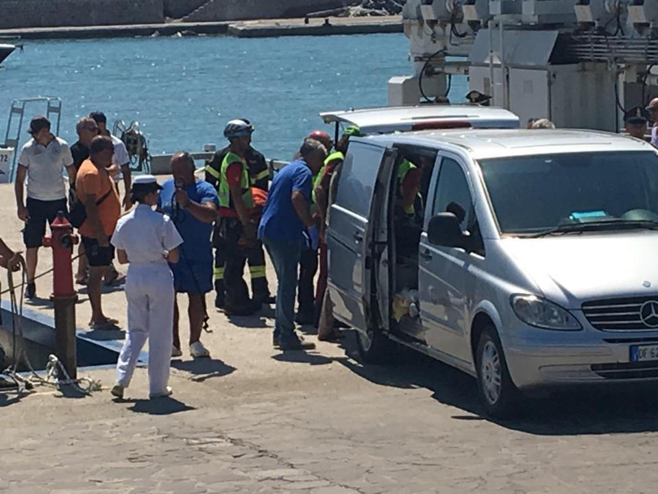 The body of French hiker Simon Gautier is carried into a car at Policastro harbor, near Salerno, southern Italy, Monday, Aug. 19, 2019. Italian mountain rescue squads have recovered the body of a French hiker who fell into a ravine and broke his leg. Nine days of search ended Sunday when alpine rescue spotted Simon Gautier’s backpack and then his body in a ravine in the Cilento region of Southern Italy. Crews were able to recover the body Monday. (Pasquale Lapadula/ANSA via AP)