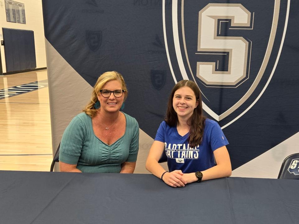 Staunton High School's Kendal Brown, right, seated next to her principal Tammy Lightner, recently committed to continue her athletic and academic career at Christopher Newport University.