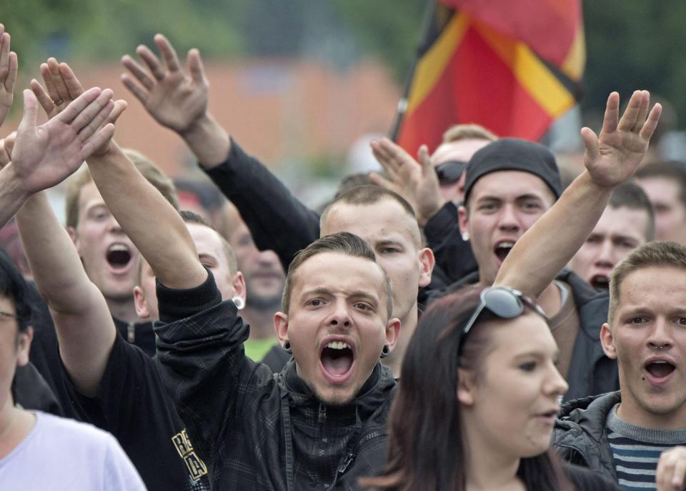 Protesters in eastern Germany demonstrate against Germany’s welcome of immigrants and refugees in 2015. (AP Photo/Jens Meyer)