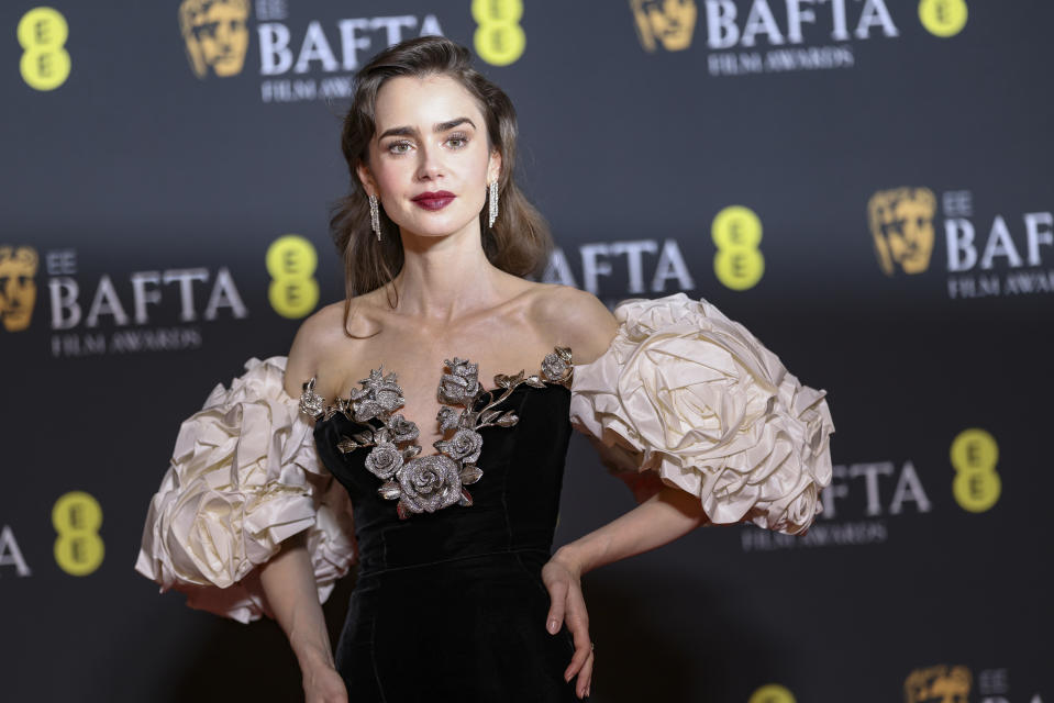 Lily Collins poses for photographers at the 77th British Academy Film Awards, BAFTA's, in London, Sunday, Feb. 18, 2024. (Photo by Vianney Le Caer/Invision/AP)