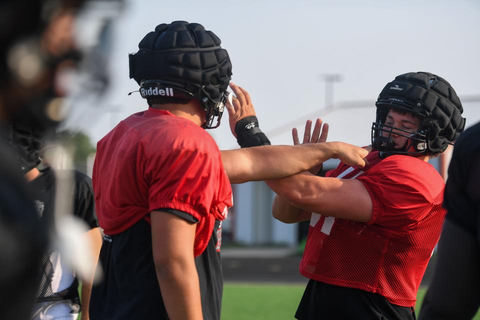Hudson Parliament (64) practices his blocking during practice at Brandon Valley High School in Brandon, South Dakota on Friday, Aug. 18, 2023. Parliament had 31 tackles last season, five for a loss.