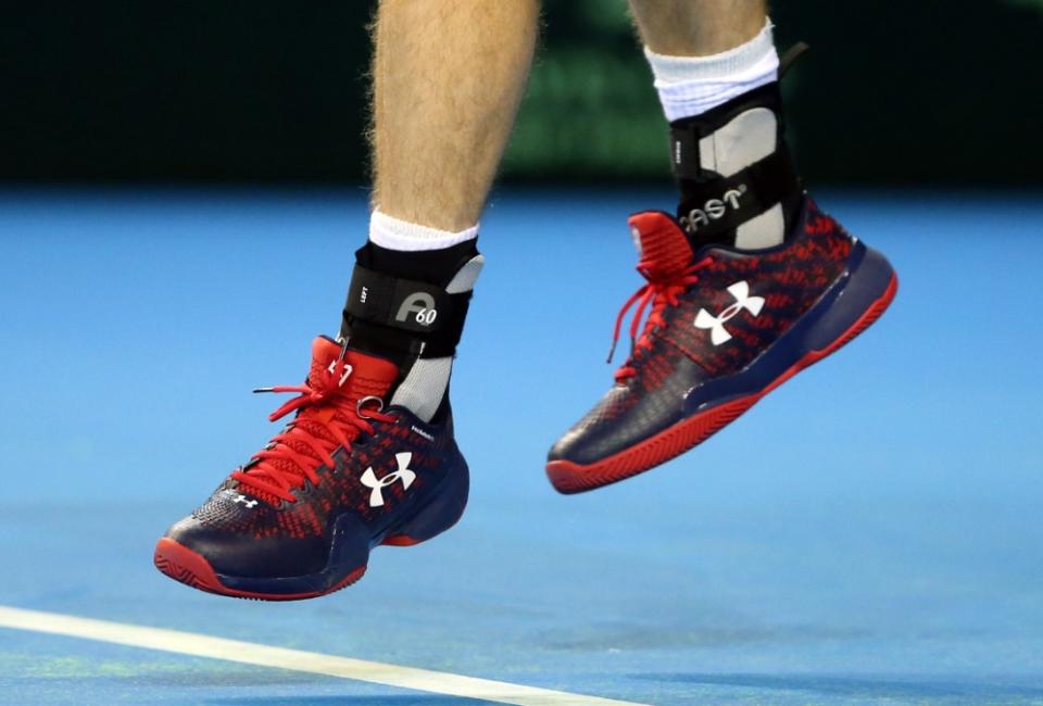 Andy Murray’s tennis shoes, with his wedding ring attached to the left shoe. - Credit: AP Images