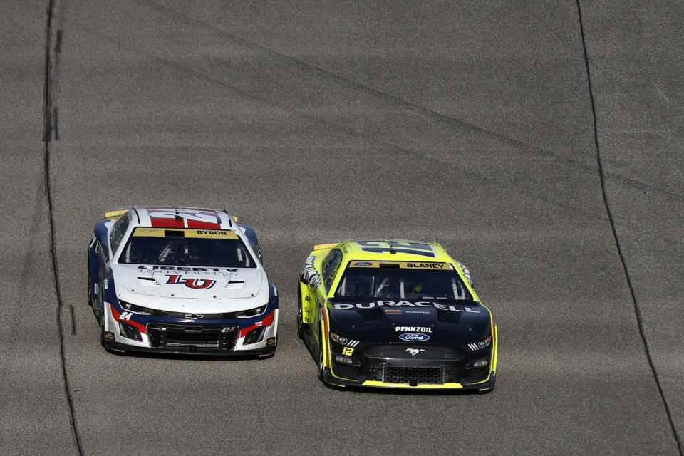 HOMESTEAD, FLORIDA - OCTOBER 22: Ryan Blaney, driver of the #12 Menards/Duracell Ford, and William Byron, driver of the #24 Liberty University Chevrolet, race during the NASCAR Cup Series 4EVER 400 Presented by Mobil 1 at Homestead-Miami Speedway on October 22, 2023 in Homestead, Florida. (Photo by Sean Gardner/Getty Images)