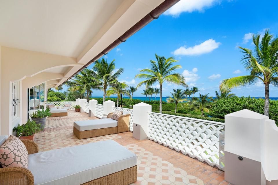 A second-floor veranda at 200 S. Ocean Blvd. in Palm Beach looks out to its beach parcel and the Atlantic Ocean. The multiple listing service shows the property just sold for $51.25 million.