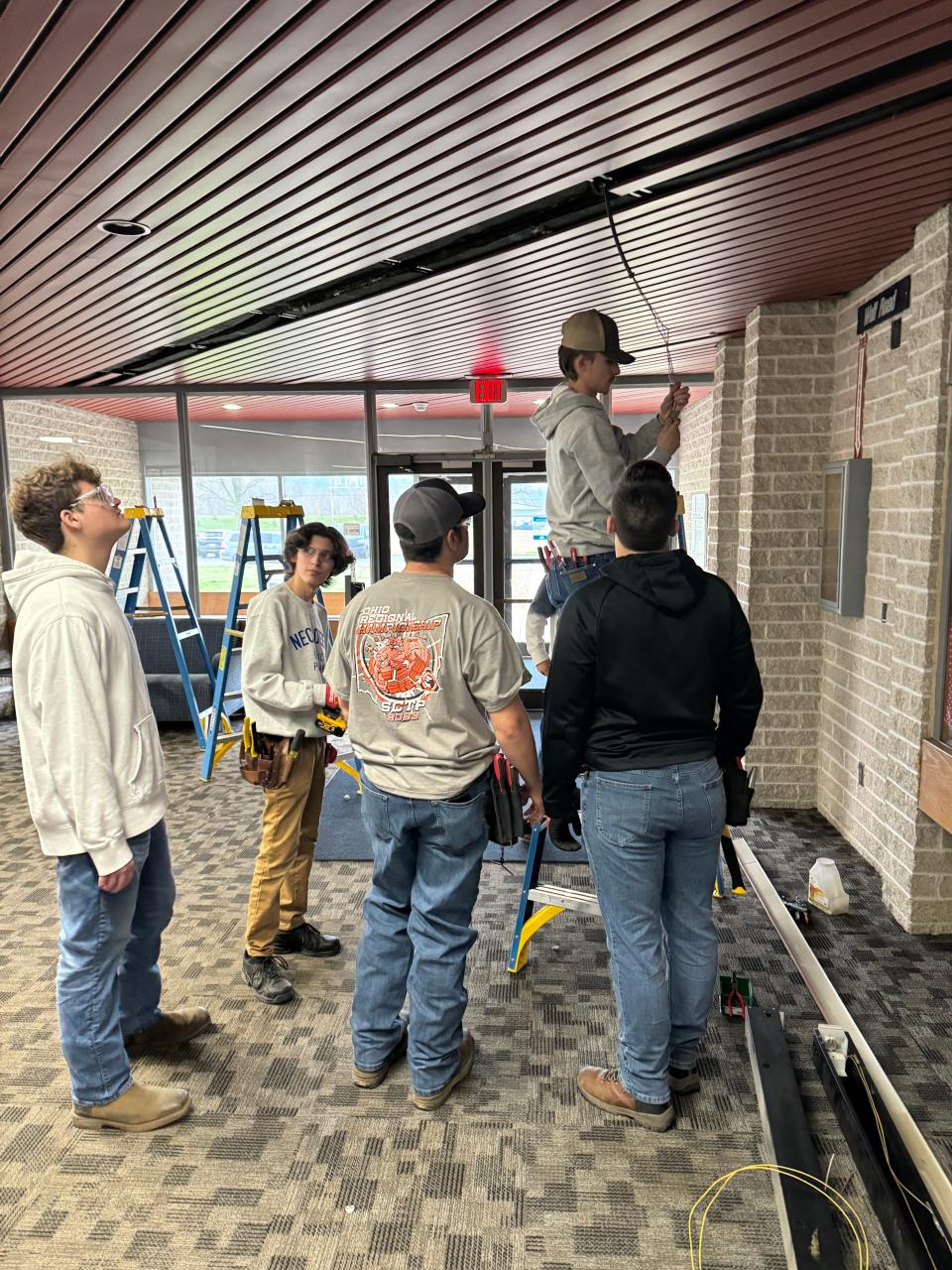 Students in the electrical systems technology program at the Coshocton County Career Center installed new LED lighting in hallways.