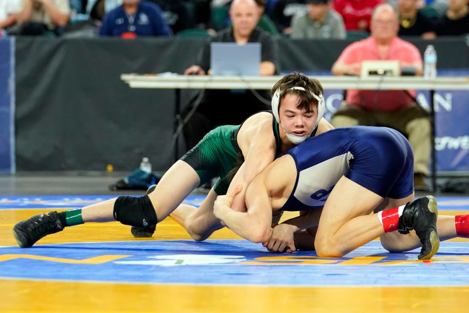 Devin Ryan of New Milford, left, wrestles Logan Brzozowski of Seton Hall Prep in the 113-pound semifinal bout on day two of the NJSIAA state wrestling tournament in Atlantic City on Friday, March 3, 2023.