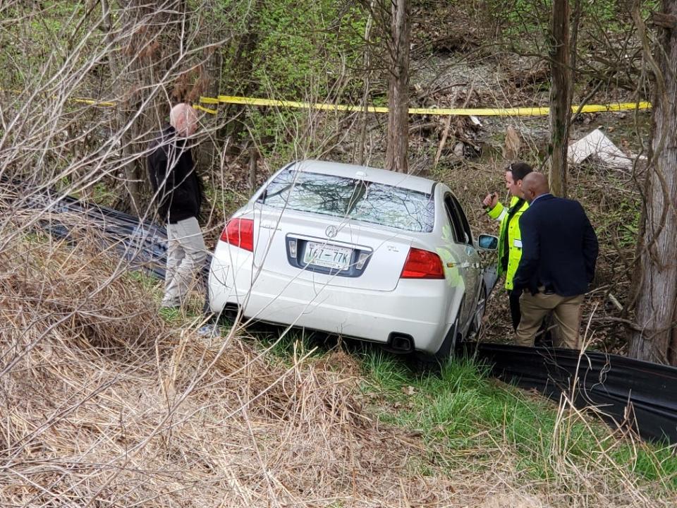Nashville, Tenn., police examine a car crash scene where the two bodies were found.
