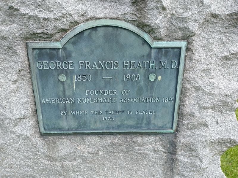 This is the historical marker honoring Dr. George Francis Heath of Monroe as the founder of the American Numismatic Association in 1891. The marker is located on Jerome Street in Woodland Cemetery and was erected by the ANA in 1925.