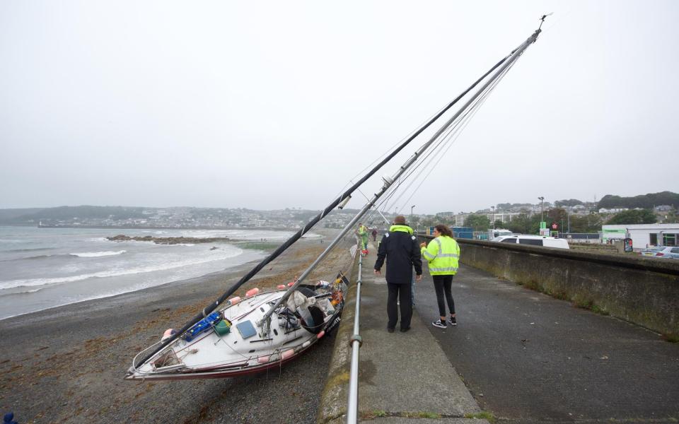 This luckless sailor's yacht has been blown on to the beach at Penzance in Cornwall - KRIS MEADEN/APEX