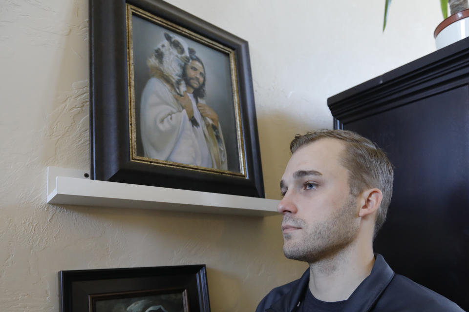 Austin Cloes, a Utah relative of the Americans killed in Mexico in what appears to be an attack by the cartels, poses for a photograph during an interview Tuesday, Nov. 5, 2019, in Herriman, Utah. Drug cartel gunmen ambushed three SUVs along a dirt road, slaughtering at least six children and three women all of them U.S. citizens living in northern Mexico in a grisly attack that left one vehicle a burned-out, bullet-riddled hulk, authorities said Tuesday, Nov. 5, 2019. (AP Photo/Rick Bowmer)