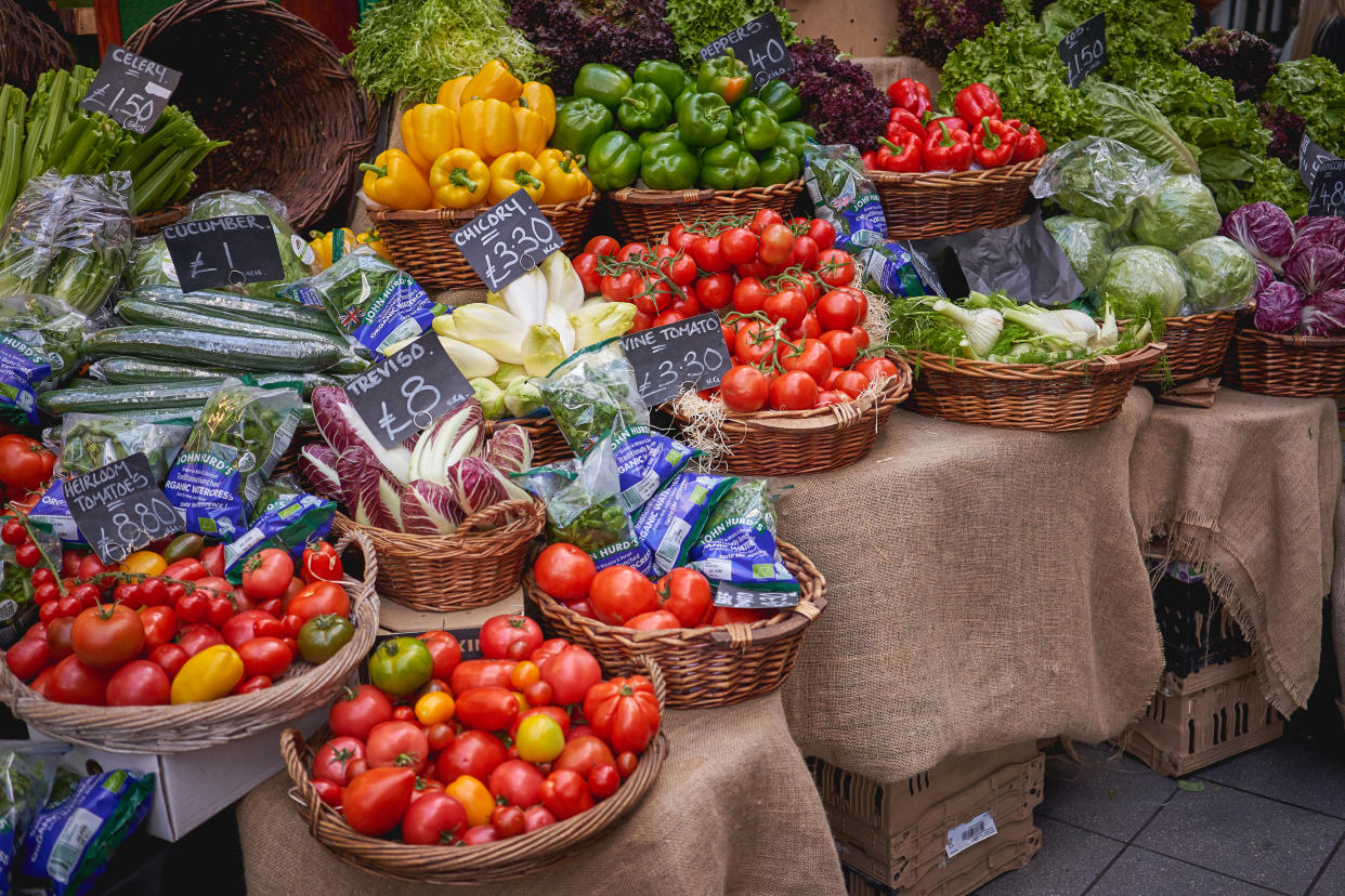 Green groceries including tomatoes, lettuce, and peppers on sale in Borough Market, London. Photo: Getty