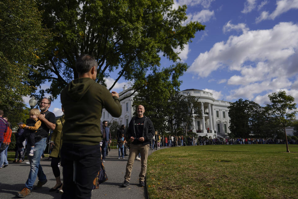 Visitors line the South Lawn during the White House during the White House Fall Garden Tour in Washington, Saturday, Oct. 8, 2022. (AP Photo/Carolyn Kaster)