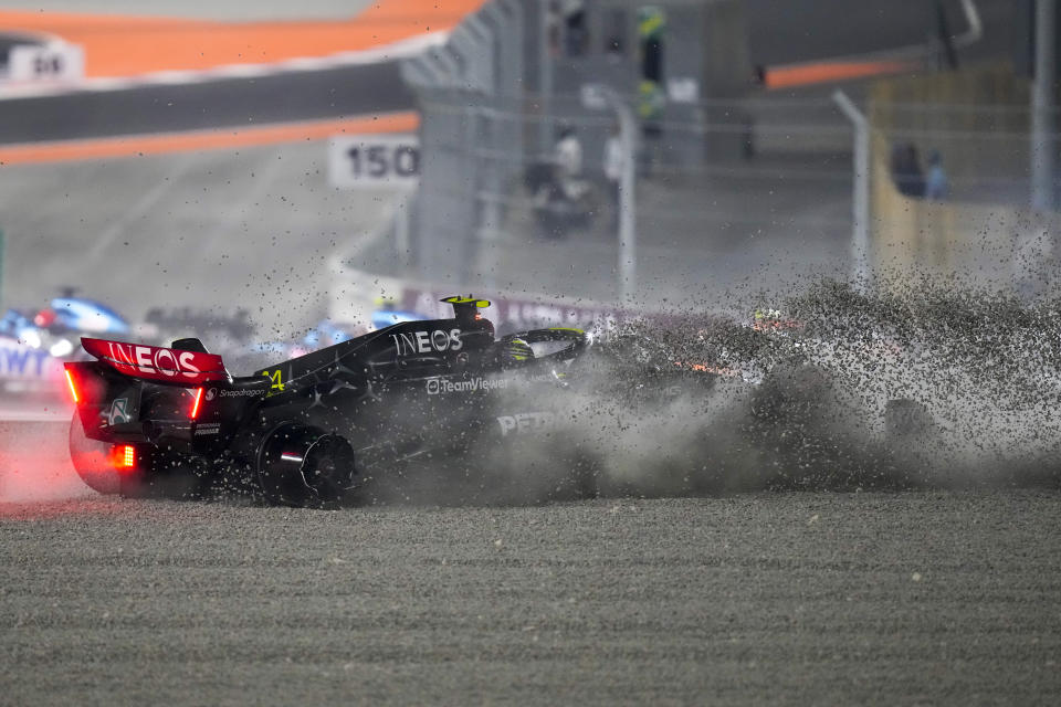 Mercedes driver Lewis Hamilton of Britain crashes at the start of the Qatar Formula One Grand Prix auto race at the Lusail International Circuit, in Lusail, Qatar, Sunday, Oct. 8, 2023. (AP Photo/Darko Bandic)