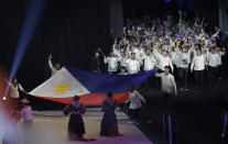 Philippine delegates cheer during the opening ceremony of the 30th South East Asian Games at the Philippine Arena, Bulacan province, northern Philippines on Saturday, Nov. 30, 2019. (AP Photo/Aaron Favila)