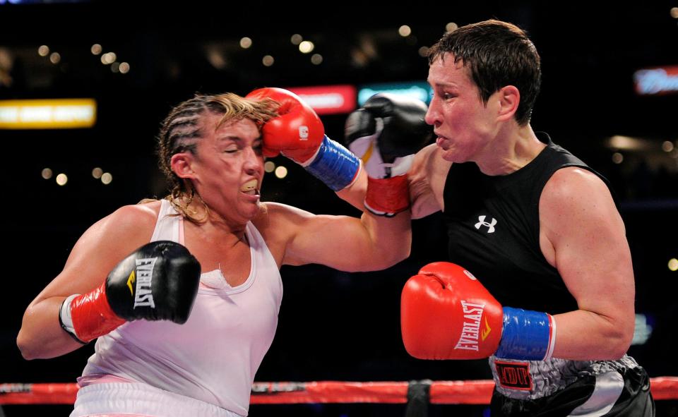 Dakota Stone, right, connects with Christy Martin during their Welterweight boxing match, Saturday, June 4, 2011, in Los Angeles. Stone won by TKO in the sixth round. (AP Photo/Mark J. Terrill)