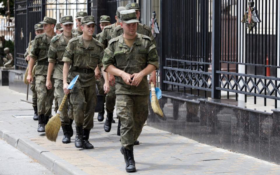 Russian soldiers clear headquarters in Rostov