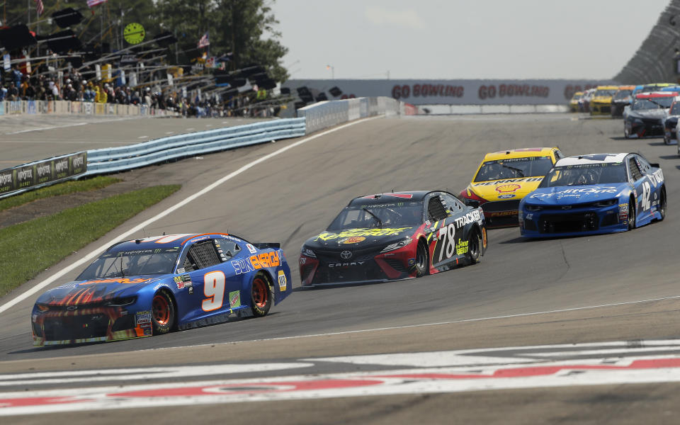Chase Elliott (9) leads the pack around Turn 1 during a NASCAR Cup Series auto race, Sunday, Aug. 5, 2018, in Watkins Glen, N.Y. (AP Photo/Julie Jacobson)