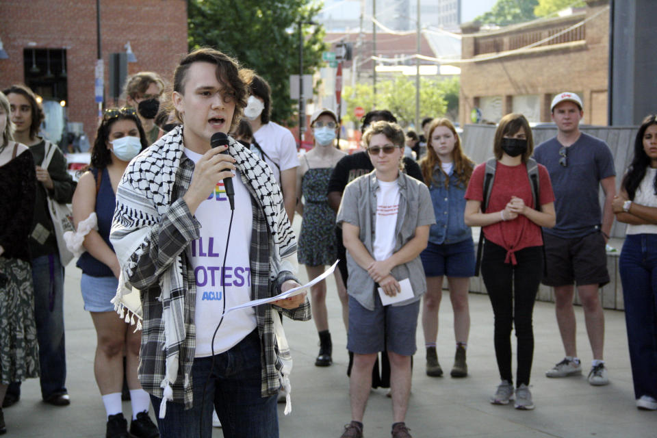 Nathaniel Dibble, a member of the Young Democratic Socialists of America at North Carolina State University, voices opposition to repealing North Carolina's public university system's diversity policy before the UNC Board of Governors' vote outside of the UNC system office in Raleigh, N.C., on Thursday, May 23, 2024. About 35 protesters from schools across the university system gathered in the demonstration. (AP Photo/Makiya Seminera)