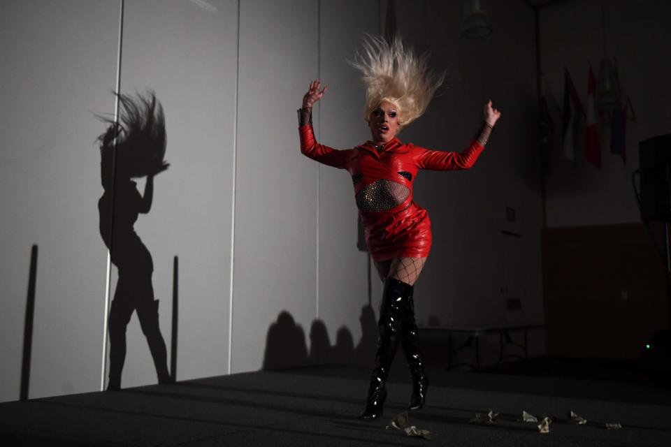 Kassie Kain flips her hair during USD Spectrum's drag show on Tuesday, Oct. 10, 2023 at Muenster University Center in Vermillion, South Dakota.