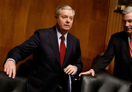 FILE PHOTO: Chairman Sen. Lindsay Graham (R-SC) arrives at a Senate Judiciary Subcommittee on Crime and Terrorism hearing about Russian election interference on Capitol Hill in Washington, D.C., U.S. March 15, 2017. REUTERS/Aaron P. Bernstein/File Photo