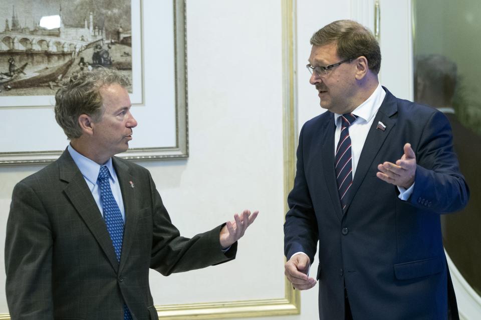 Sen. Rand Paul, left, speaks with Chairman of the Russian Federation Council Committee on International Affairs Konstantin Kosachev during their meeting in Moscow, Russia, Monday, Aug. 6, 2018. Paul said he invited Russian lawmakers to visit the United States to help foster inter-parliamentary contacts. (AP Photo/Pavel Golovkin)