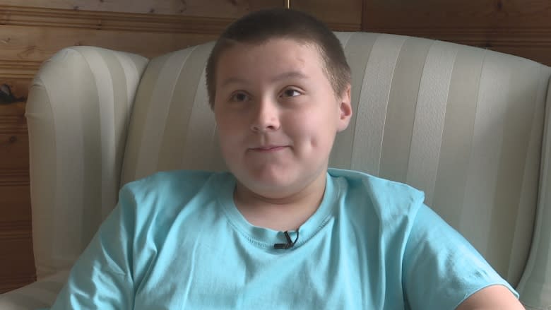 Boy who lost father in Highway 103 crash honours him through clothing drive