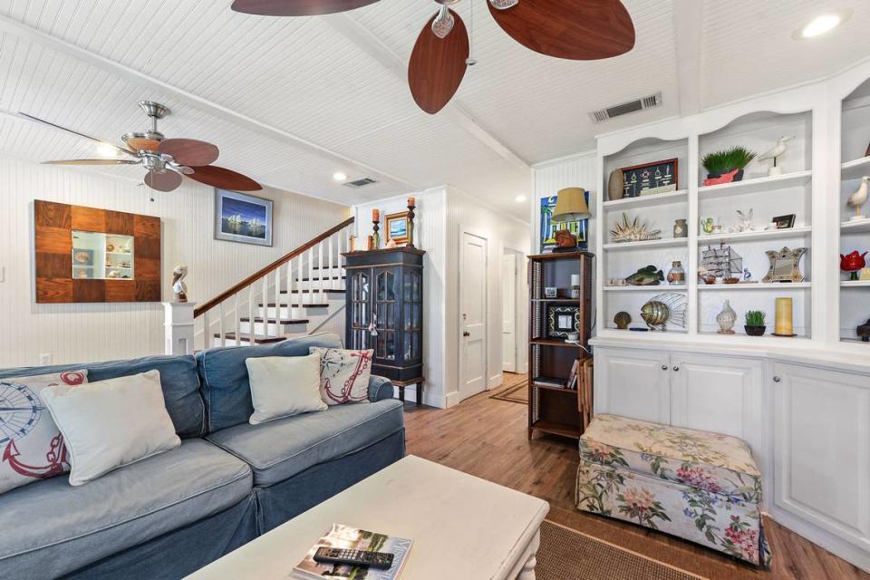 The living room at Breezy Porches in Waveland, where owners Glenn Hood and Charles “Chuck” Underwood have filled the unique home with art and creative design elements. MS Real Estate Photography