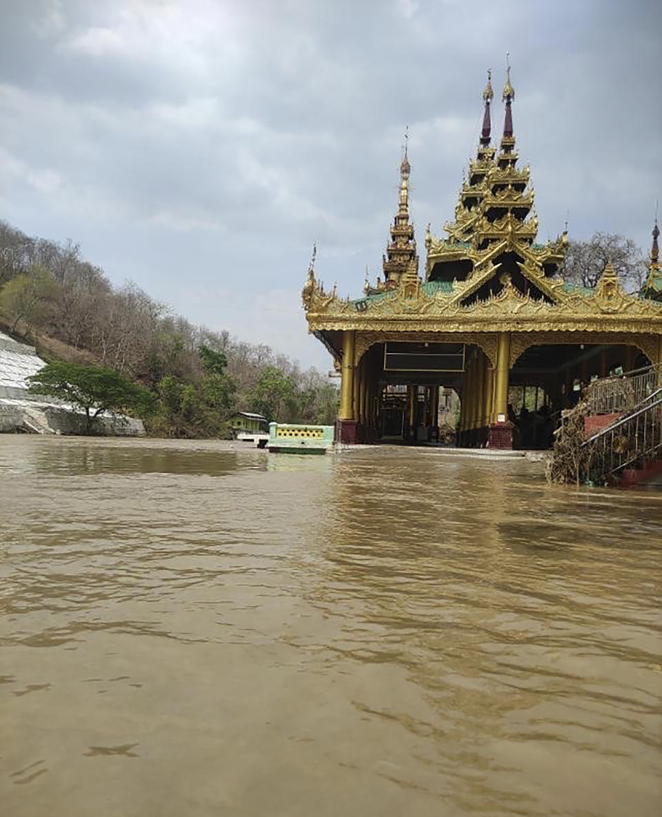 In this photo provided by Myanmar Military True News Information Team on Monday, May 15, 2023, a flooded area caused by Cyclone Mocha is seen near Mann Shwe Sat Taw pagoda in Magwe Division, central Myanmar. Rescuers early Monday evacuated about 1,000 people trapped by seawater 3.6 meters (12 feet ) deep along western Myanmar's coast after the powerful cyclone injured hundreds and cut off communications. (Military True News Information Team via AP)