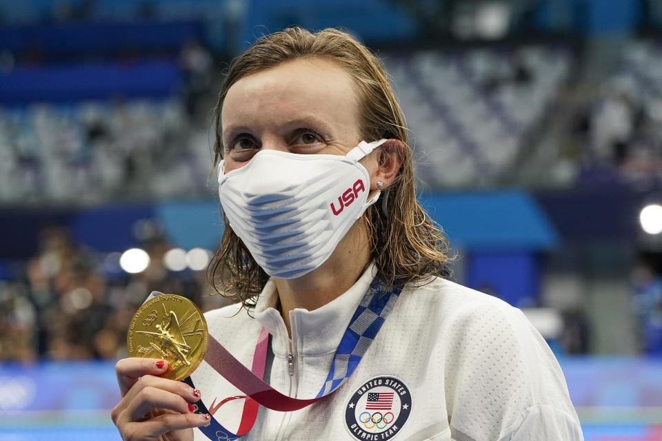 Kathleen Ledecky, of United States, poses after winning the gold medal in the women's 800-meter freestyle final at the 2020 Summer Olympics, Saturday, July 31, 2021, in Tokyo, Japan. (AP Photo/Jae C. Hong)