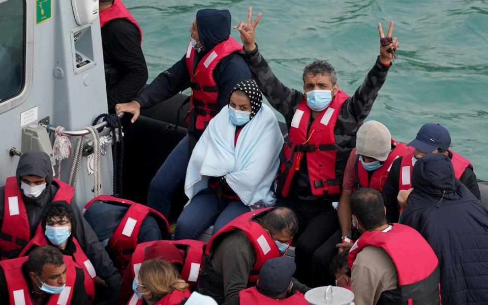 Migrants are brought in to Dover, Kent, by Border Force officers on Sunday - Gareth Fuller/PA Wire